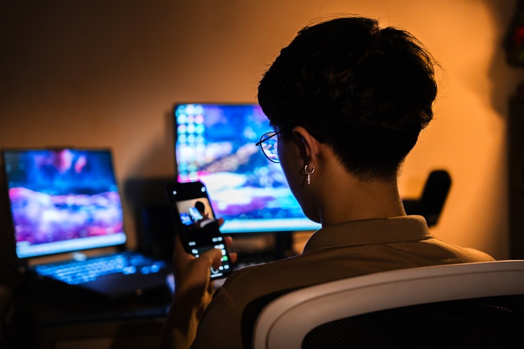 person using laptop at desk